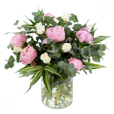 Pink Clouds - This dreamy vase arrangement promises to make a lasting impression! Comprised with only the finest peonies along with an entourage of roses. Delivered in a pink and white colourway with complimentary foliage.